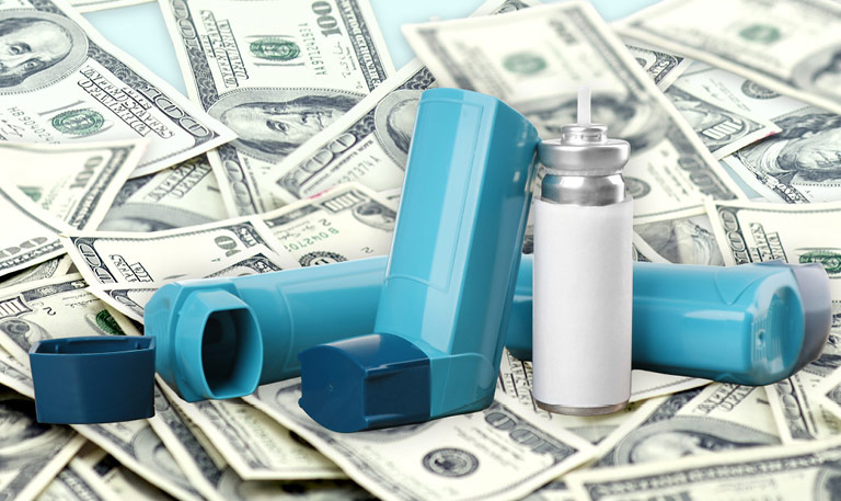 Inhalers sitting on a pile of money