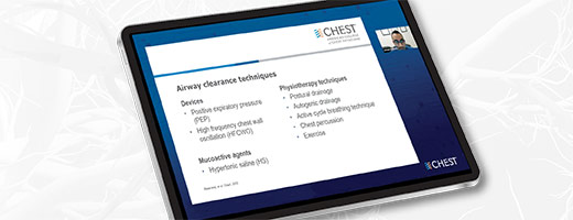 A tablet showing a screenshot of an airway clearance webinar, on a green background