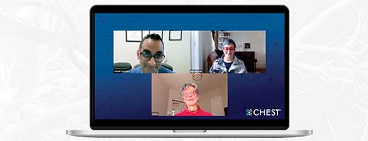 A laptop showing a screenshot of a webinar with three faces, on a green background